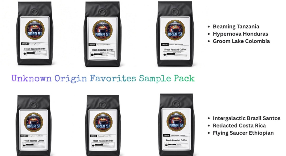 Six black coffee bags arranged in two rows on a white background, with text listing coffee varieties: Beaming Tanzania, Hypernova Honduras, Groom Lake Colombia, Intergalactic Brazil Santos, Redacted Costa Rica, and Flying Saucer Ethiopia. Large text reads 'Unknown Origin Favorites Sample Pack.